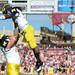 Michigan offensive linesman Taylor Lewan lifts up senior quarterback Denard Robinson as they end warms up before the start of the Outback Bowl at Raymond James Stadium in Tampa, Fla. on Tuesday, Jan. 1. Melanie Maxwell I AnnArbor.com